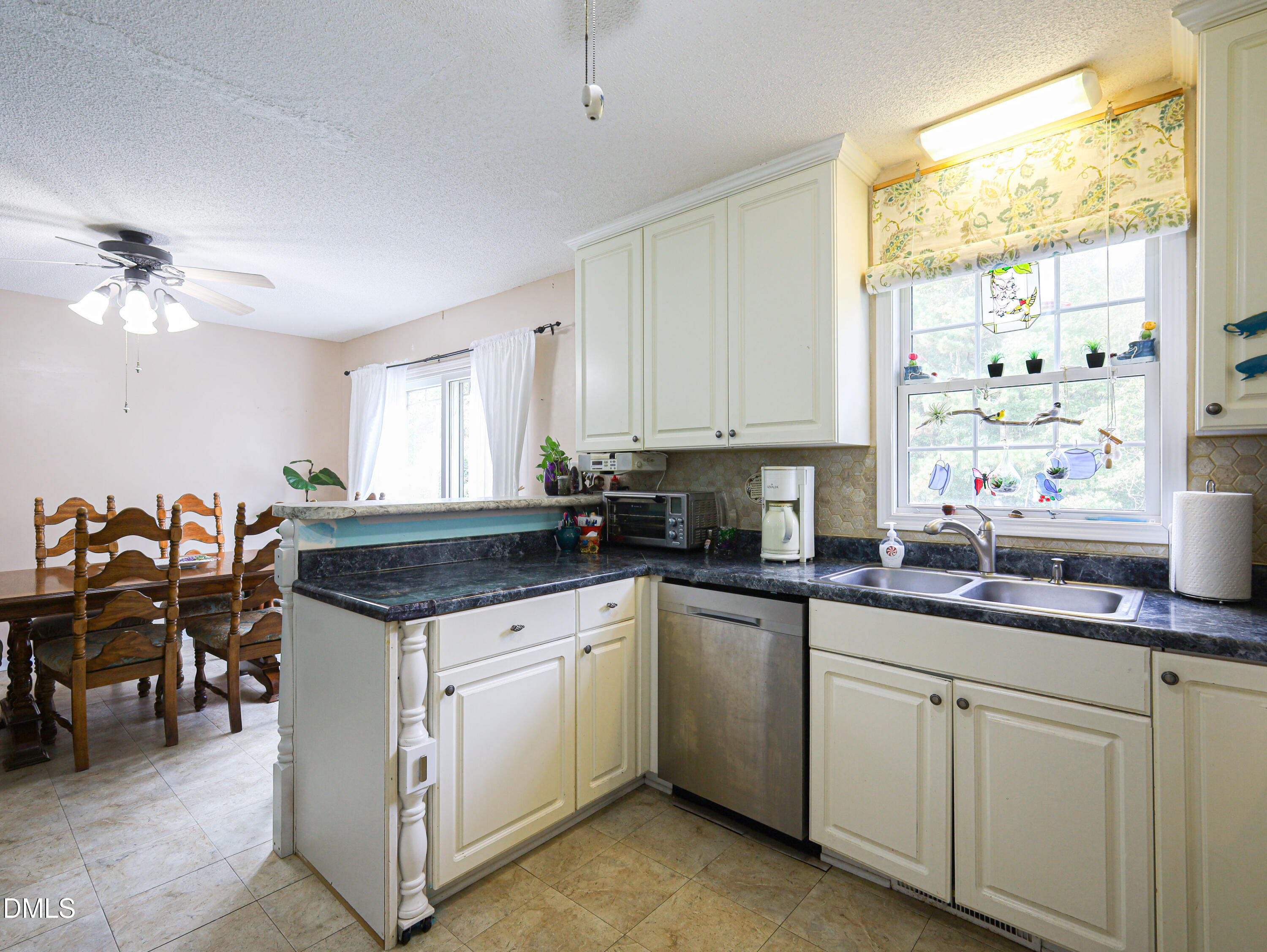 182 Scotts Lane Angier, NC 27501 - Photo 4 of 12 a kitchen with a sink stove and cabinets