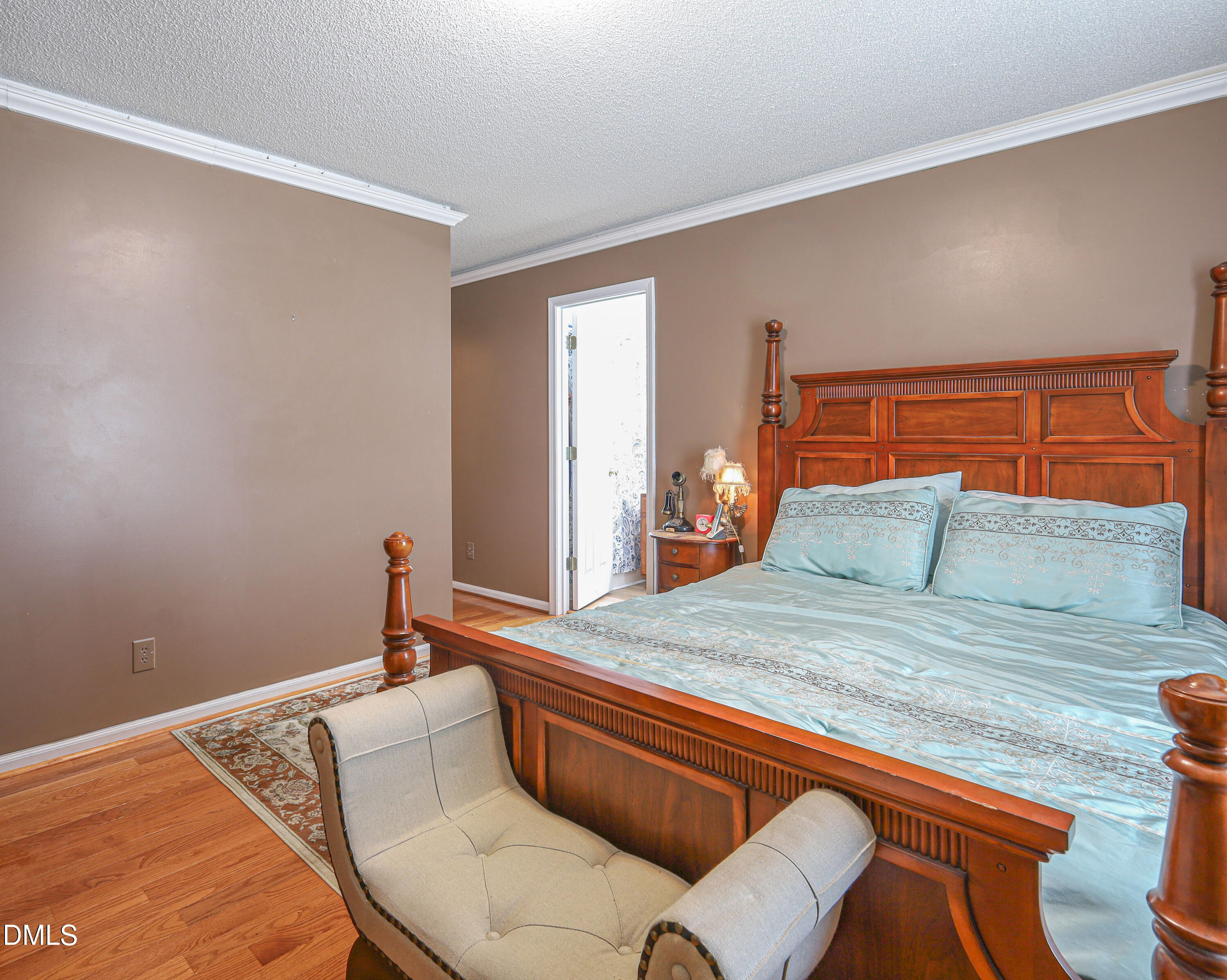 182 Scotts Lane Angier, NC 27501 - Photo 6 of 12 a bedroom with a bed and chair