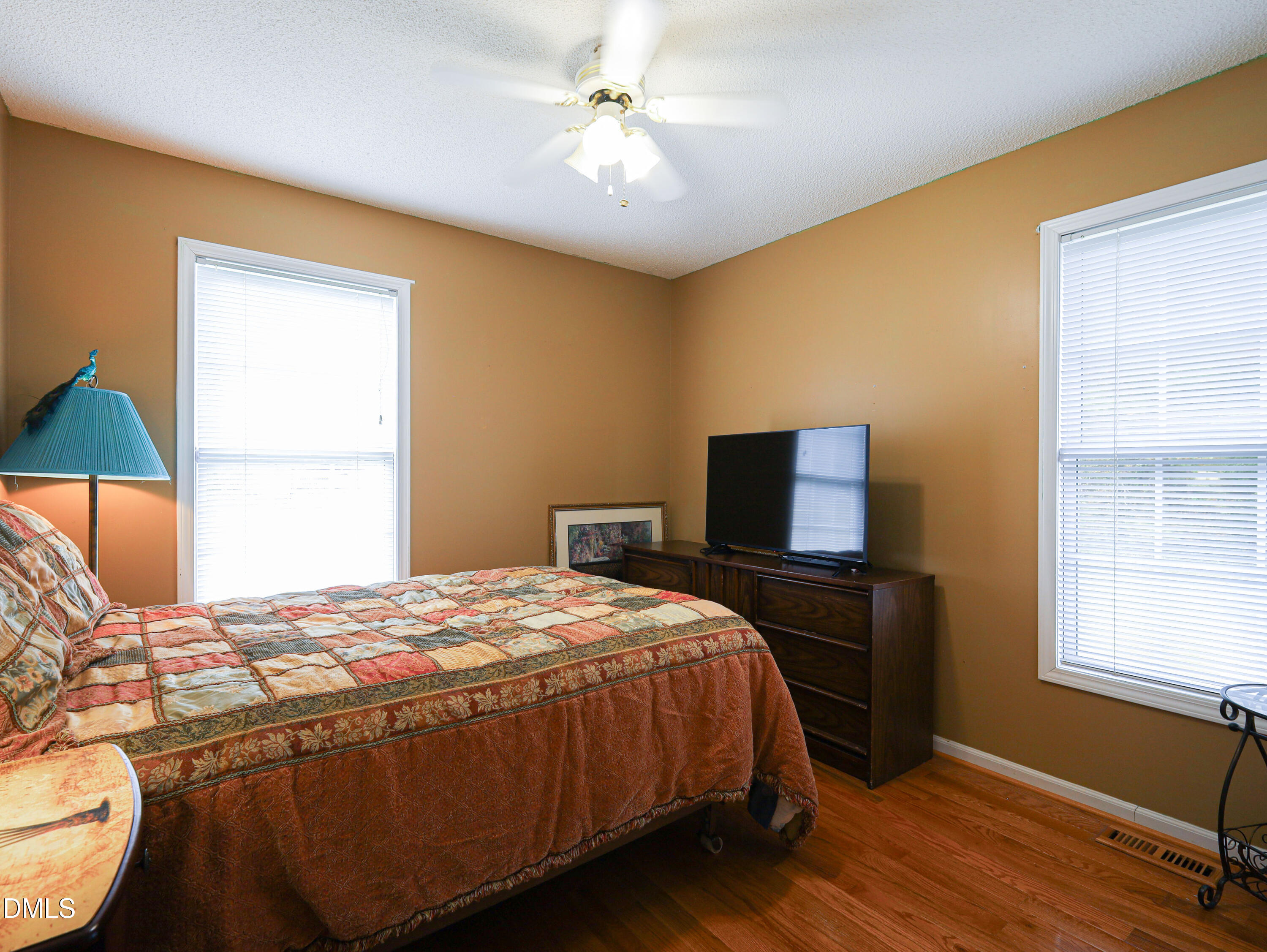 182 Scotts Lane Angier, NC 27501 - Photo 9 of 12 a bedroom with a bed and a window
