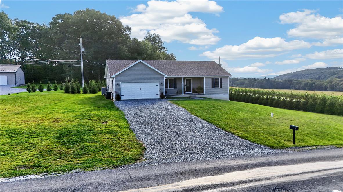 74 Kepners Road New Ringgold, PA 17960 - Photo 1 of 79 A gravel driveway leads to this charming ranch home set against a scenic mountain backdrop.