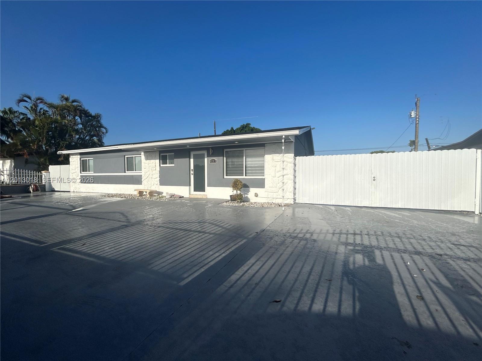 6202 Southwest 107th Avenue Miami, FL 33173 - Photo 3 of 22 a view of a house with a patio