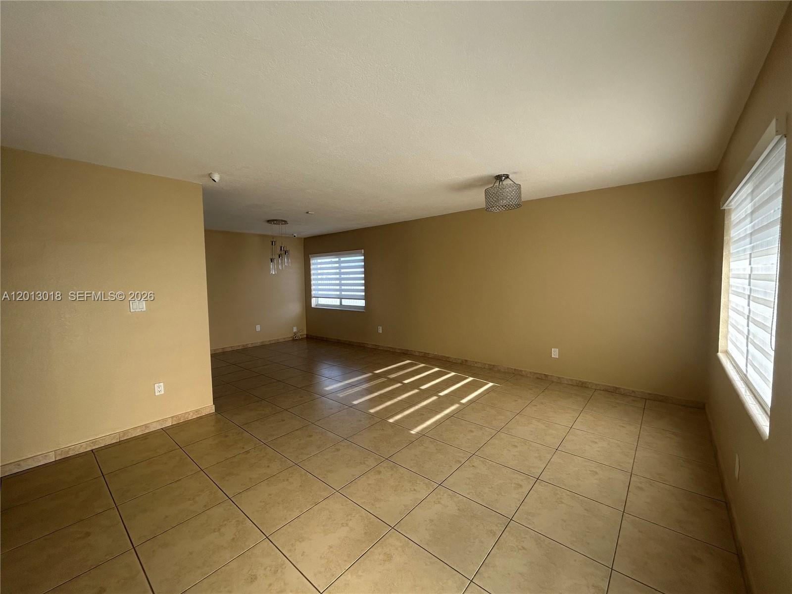 6202 Southwest 107th Avenue Miami, FL 33173 - Photo 6 of 22 a view of an empty room and window