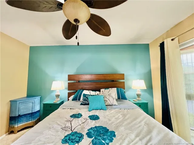 a bedroom with a bed and cabinets