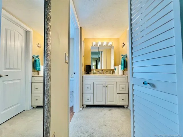 a bathroom with a double vanity sink and mirror