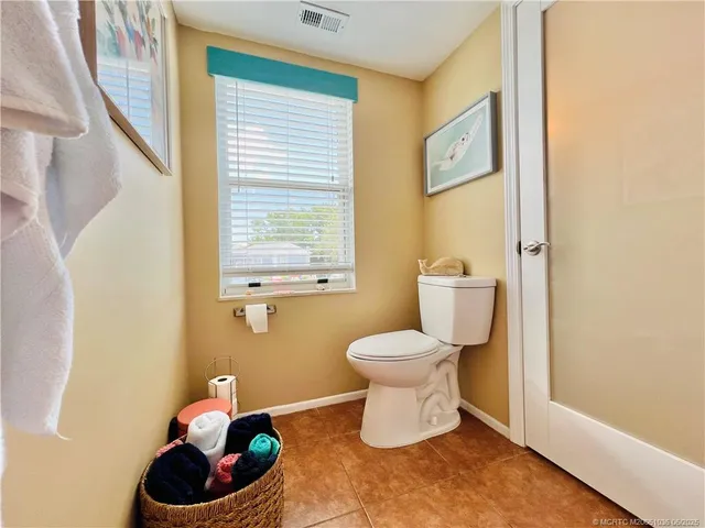 a bathroom with a toilet and a sink