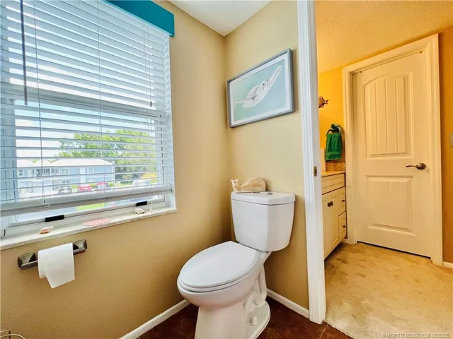 a bathroom with a toilet sink and tub