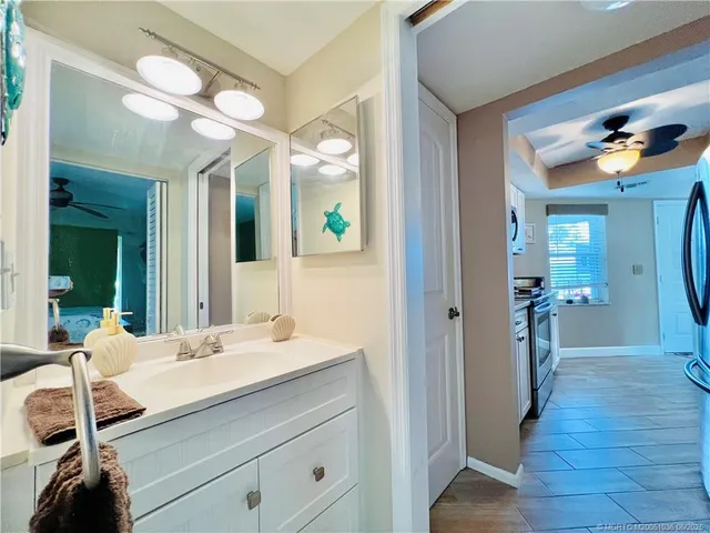 a bathroom with a sink a vanity and a mirror
