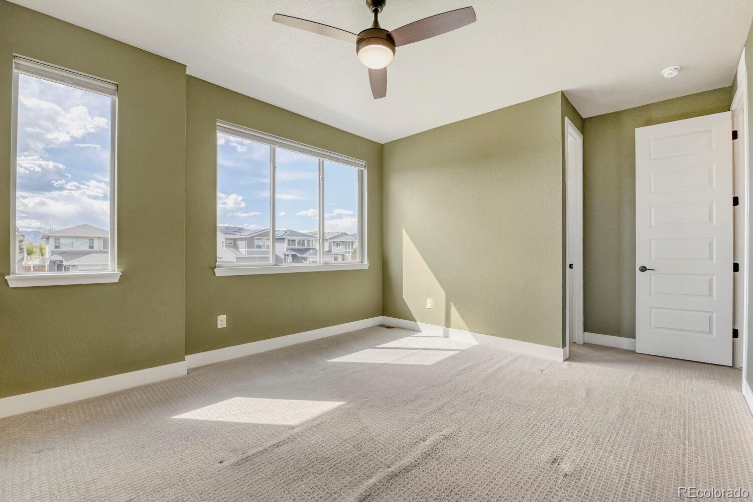 6850 Decatur Street Denver, CO 80221 - Photo 18 of 30 a view of an empty room with a window