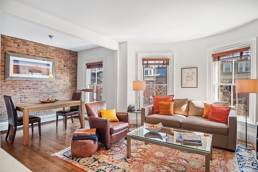 40 Rutland Square, Unit 5 Boston, MA 02118 - Photo 2 of 19 a living room with furniture wooden floor and a table