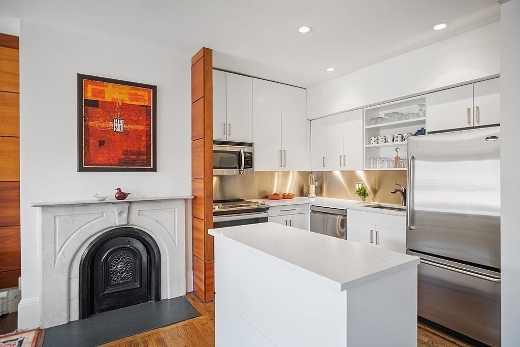 40 Rutland Square, Unit 5 Boston, MA 02118 - Photo 5 of 19 a kitchen with a refrigerator and a sink