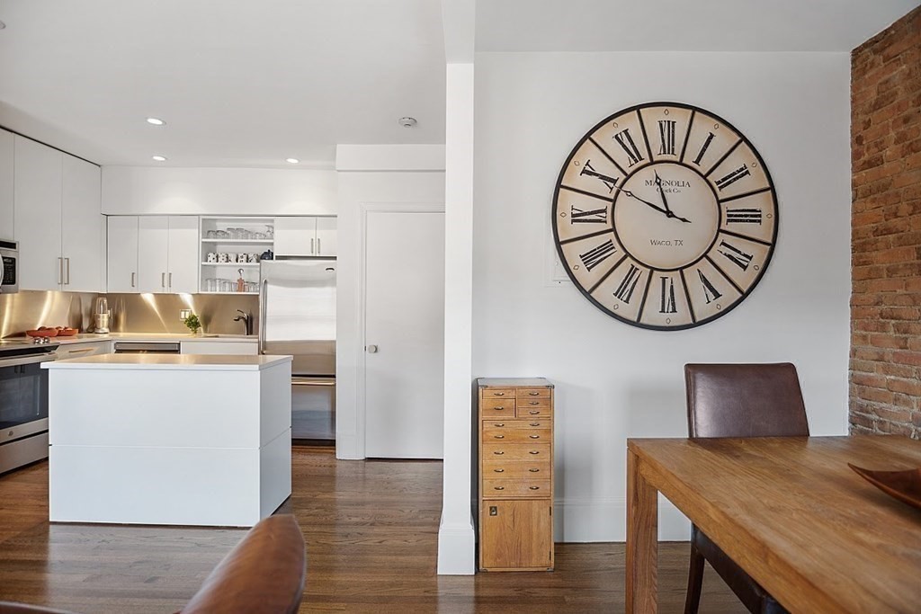 40 Rutland Square, Unit 5 Boston, MA 02118 - Photo 6 of 19 a view of kitchen with cabinets and wooden floor