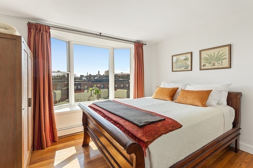 40 Rutland Square, Unit 5 Boston, MA 02118 - Photo 9 of 19 a bed sitting in a bedroom next to a window