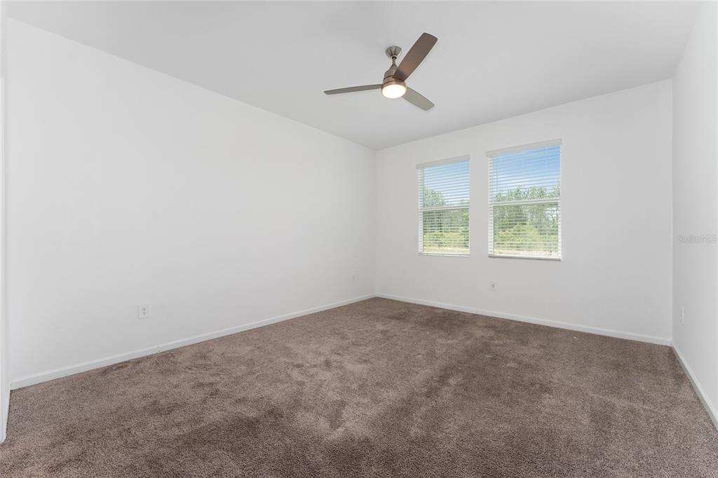 566 Hatteras Road Davenport, FL 33837 - Photo 11 of 28 an empty room with a window
