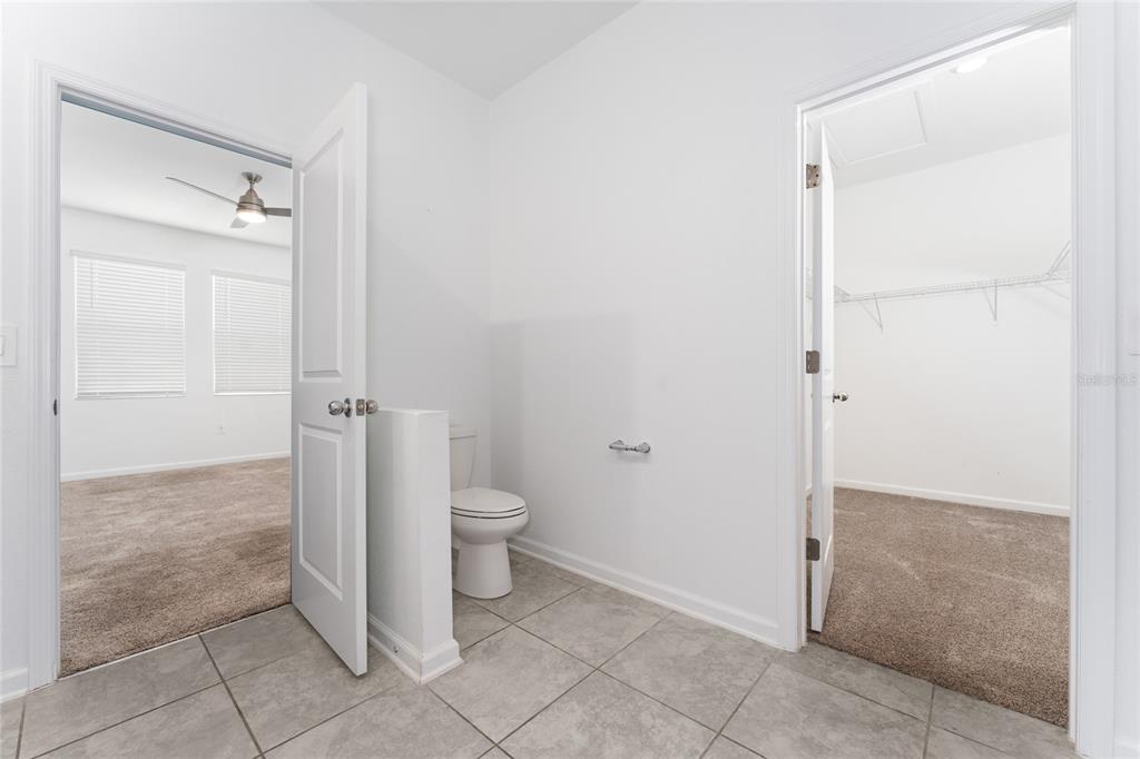 566 Hatteras Road Davenport, FL 33837 - Photo 14 of 28 a bathroom with a toilet