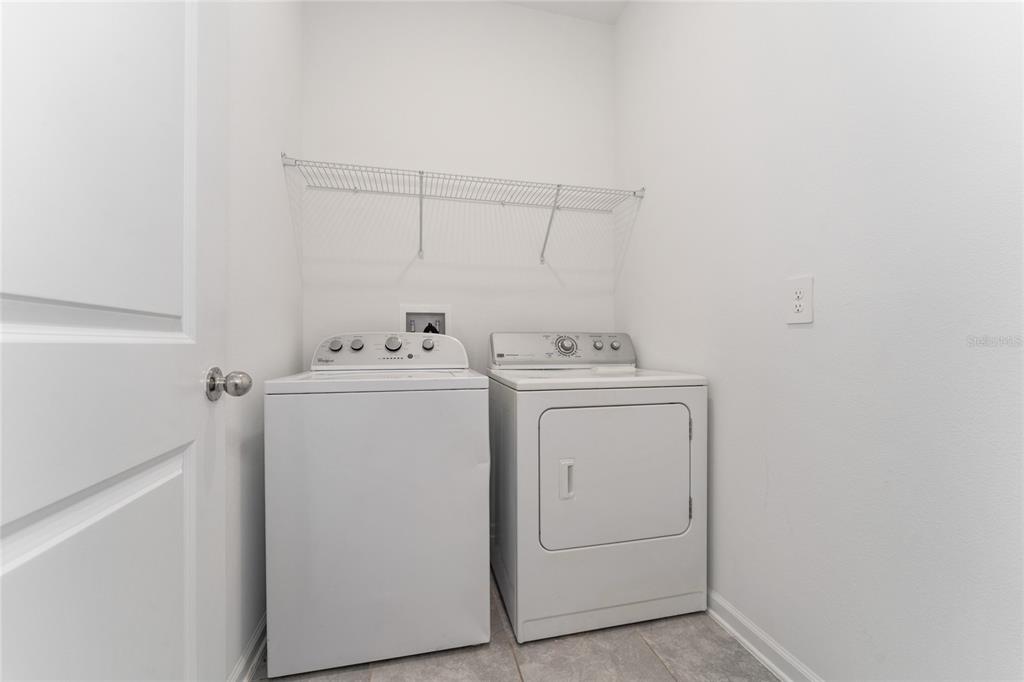 566 Hatteras Road Davenport, FL 33837 - Photo 15 of 28 a utility room with dryer and washer