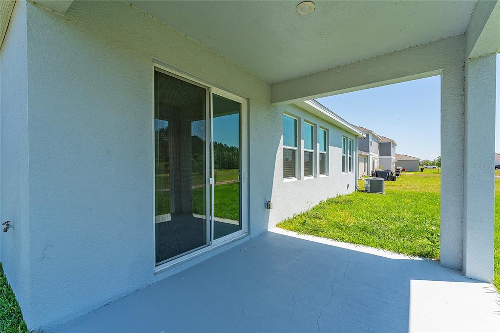 566 Hatteras Road Davenport, FL 33837 - Photo 23 of 28 front view of a house with a small yard