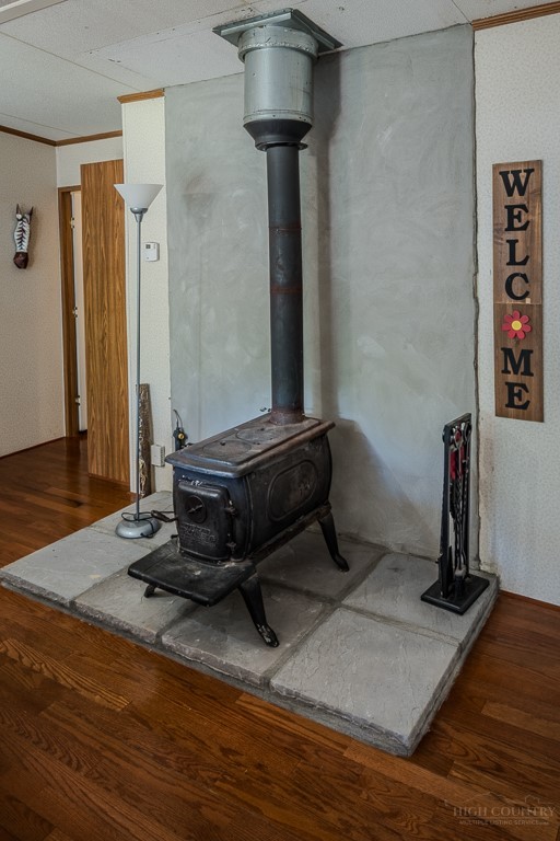 461 Reuben Wooten Road Banner Elk, NC 28604 - Photo 12 of 39 a room with wooden floor and furniture