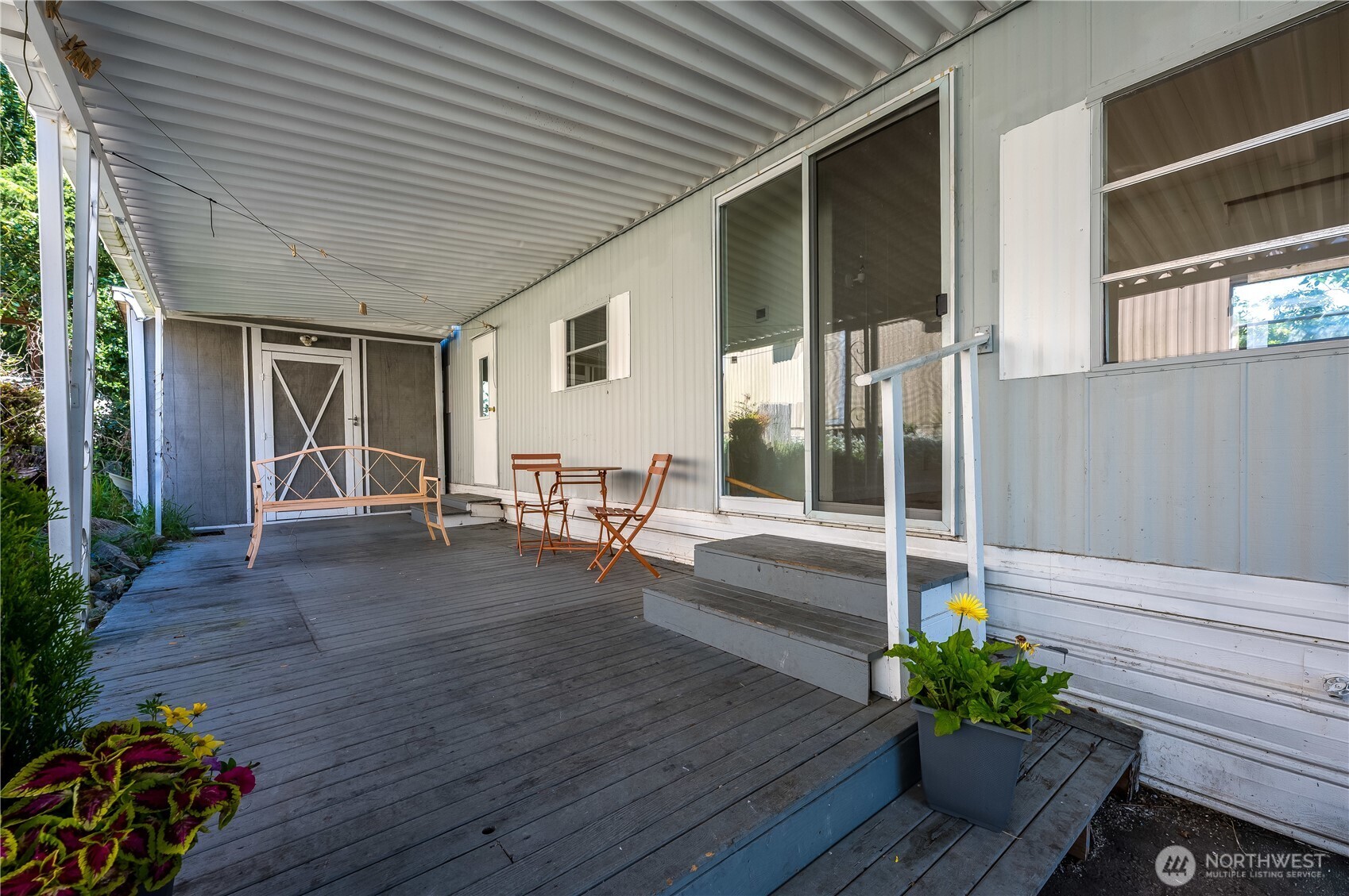 23708 Locust Way, Unit 29 Bothell, WA 98021 - Photo 3 of 14 a porch with seating space and hardwood floor