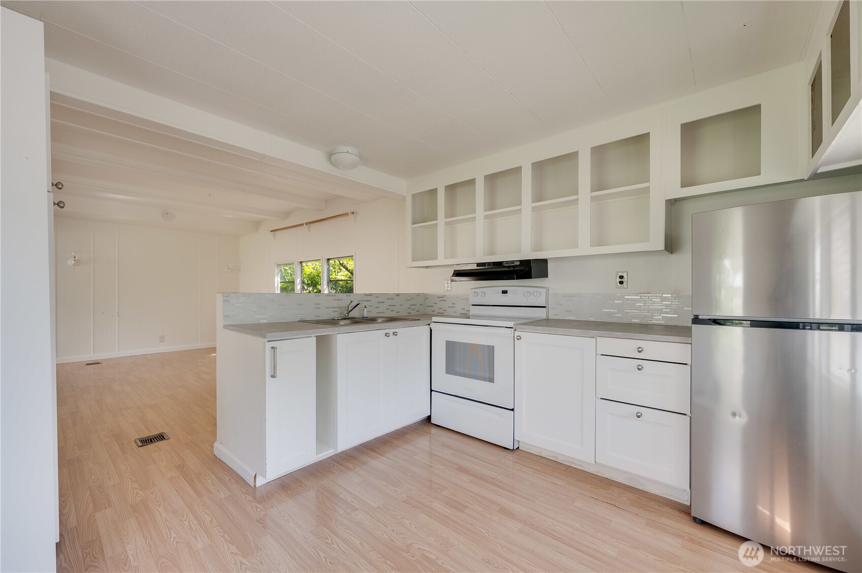 23708 Locust Way, Unit 29 Bothell, WA 98021 - Photo 4 of 14 a kitchen with white cabinets and white appliances