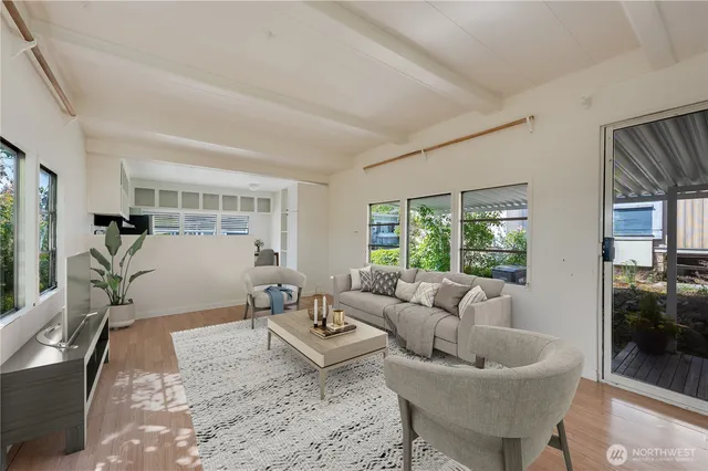 a living room with furniture and a table