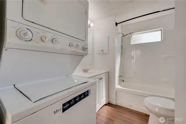 a view of bathroom with a tub and shower