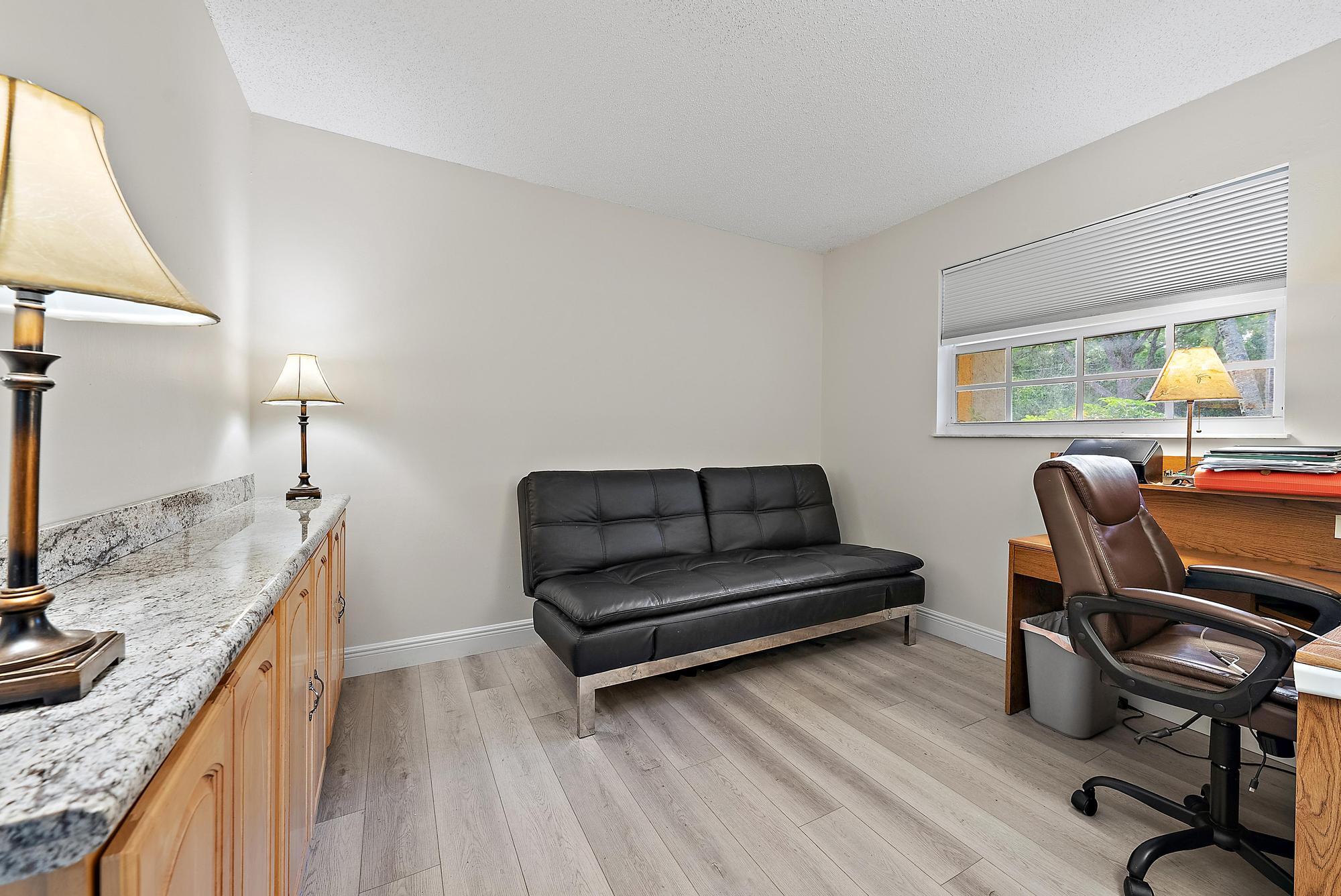 16338 Alexander Run Jupiter, FL 33478 - Photo 20 of 32 a living room with furniture and a piano