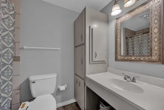 a children room with toys and a fan