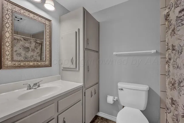 a bedroom with two beds and a window