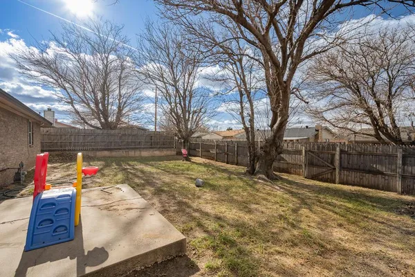 a view of a backyard of the house