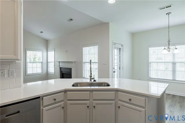 a bathroom with a sink and a window