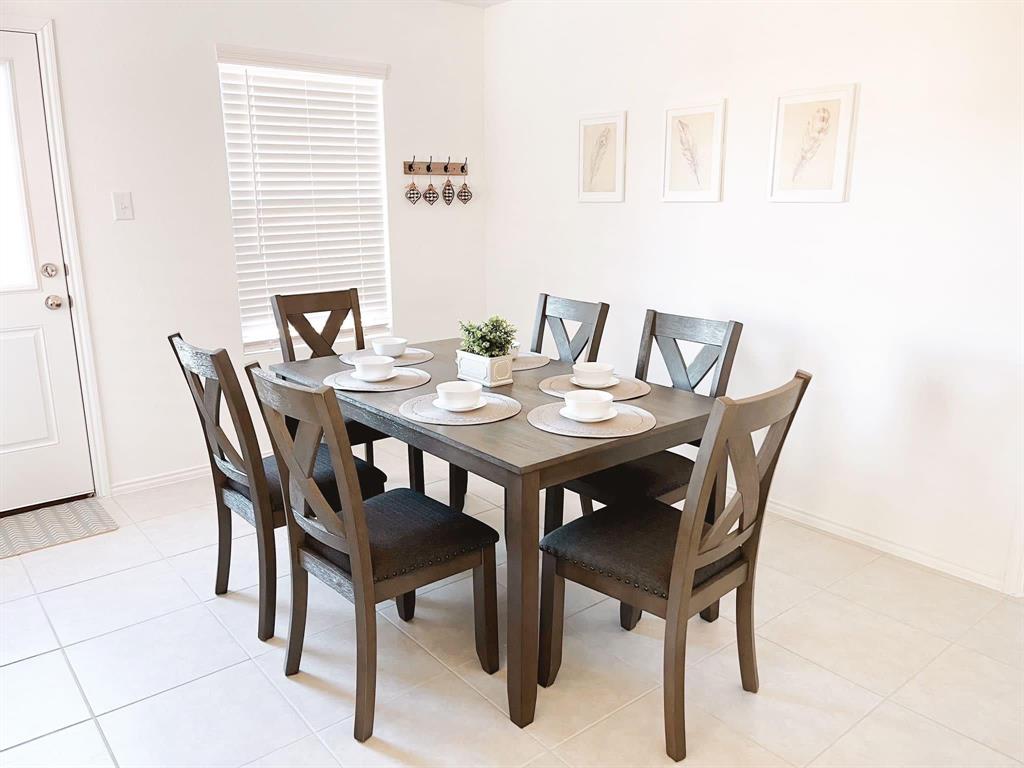 136 Honeysuckle Street Princeton, TX 75407 - Photo 6 of 13 a view of a dining room with furniture