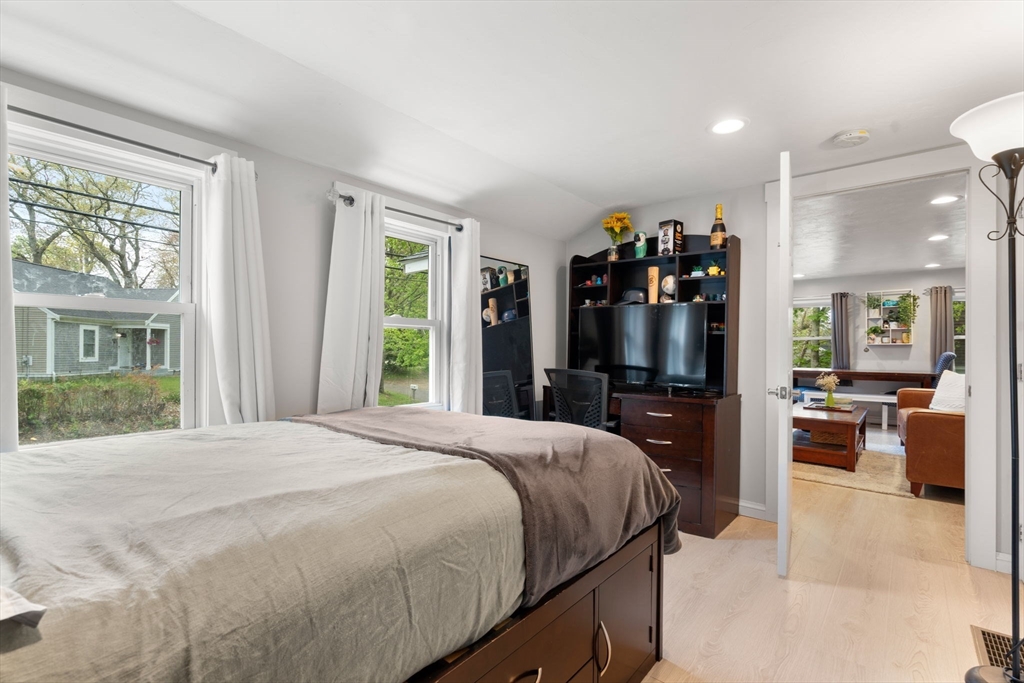 7 Indian Neck Road Wareham, MA 02571 - Photo 29 of 34 a bedroom with a large bed and a large window