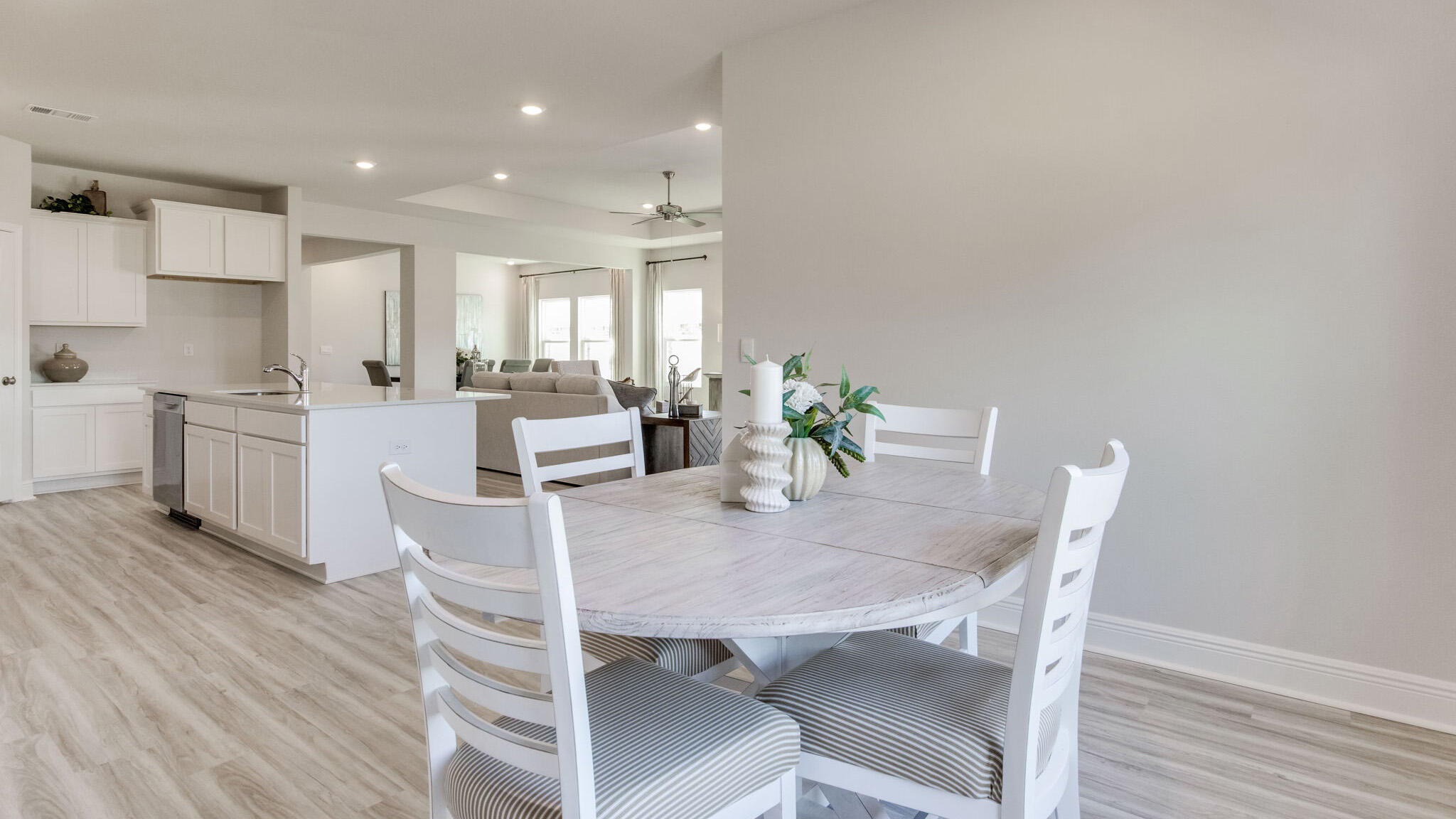 8688 Bluebell Street Milton, FL 32583 - Photo 13 of 32 a view of a dining room with furniture and wooden floor