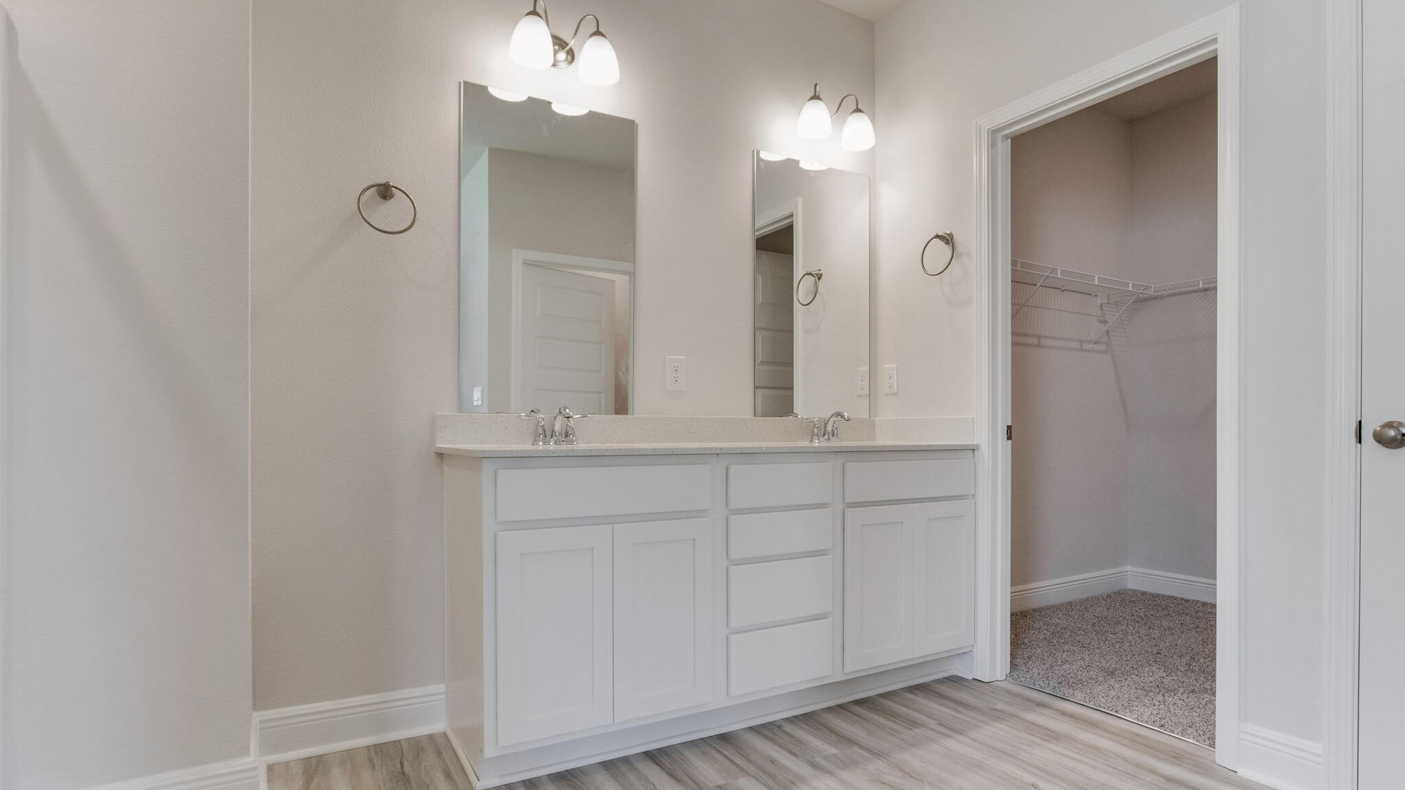8688 Bluebell Street Milton, FL 32583 - Photo 20 of 32 a bathroom with a sink and a mirror