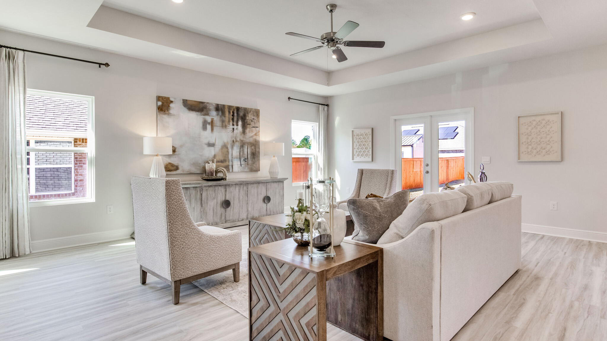 8688 Bluebell Street Milton, FL 32583 - Photo 6 of 32 a living room with furniture a dining table and wooden floor