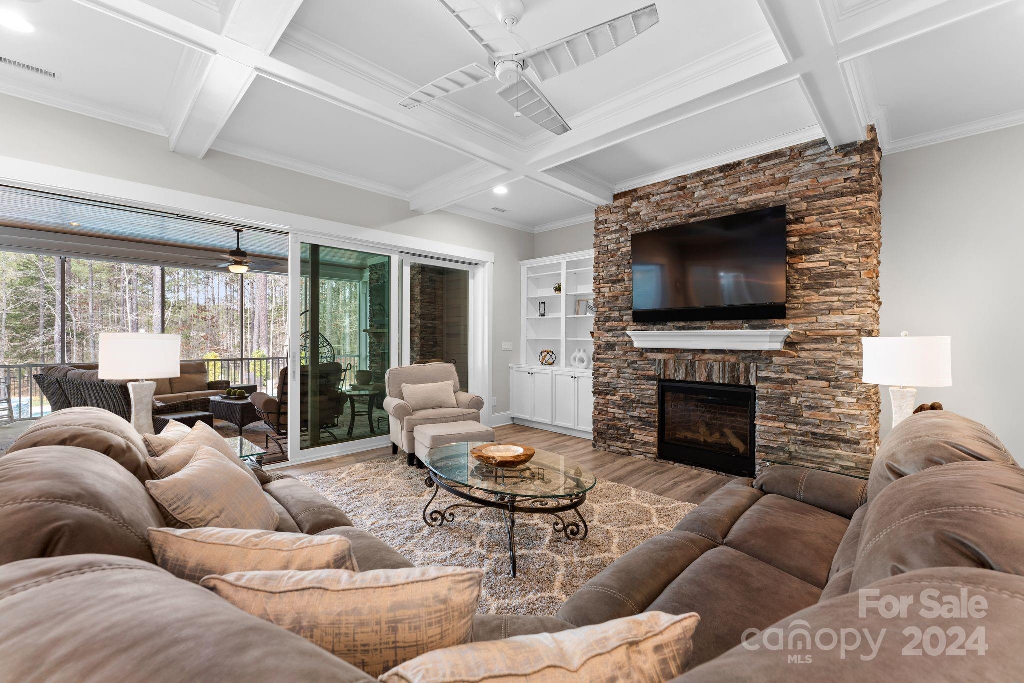 6084 Chimney Bluff Road Lancaster, SC 29720 - Photo 13 of 39 a living room with furniture a fireplace and a flat screen tv