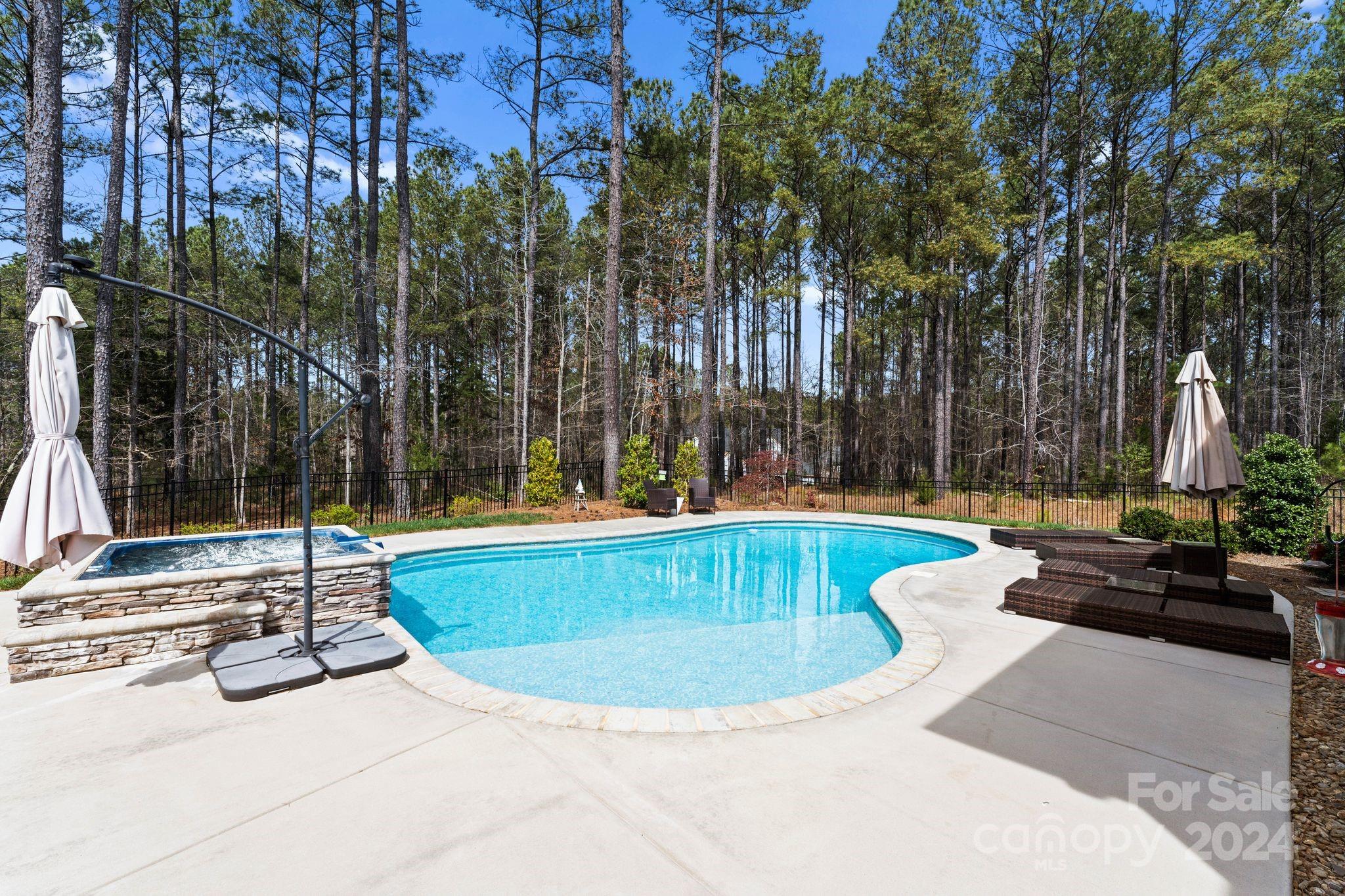 6084 Chimney Bluff Road Lancaster, SC 29720 - Photo 3 of 39 a view of a swimming pool with a sitting area