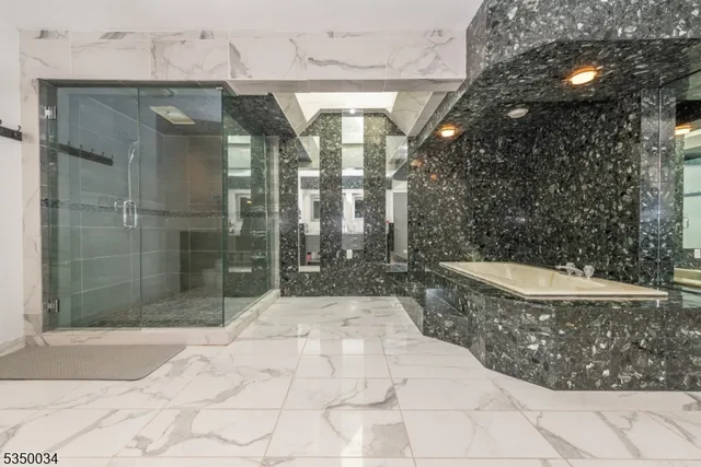 a living room with furniture and two windows