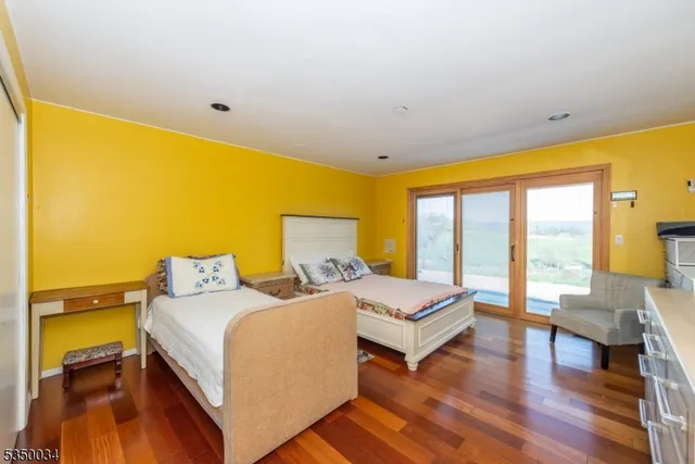 a view of a grassy field with trees