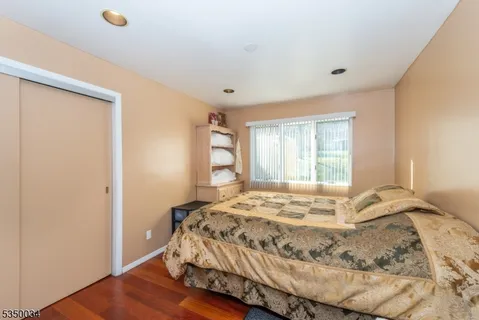 a view of a house with a yard and potted plants