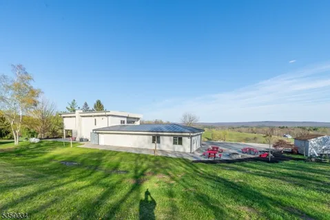 an aerial view of a house with a swimming pool