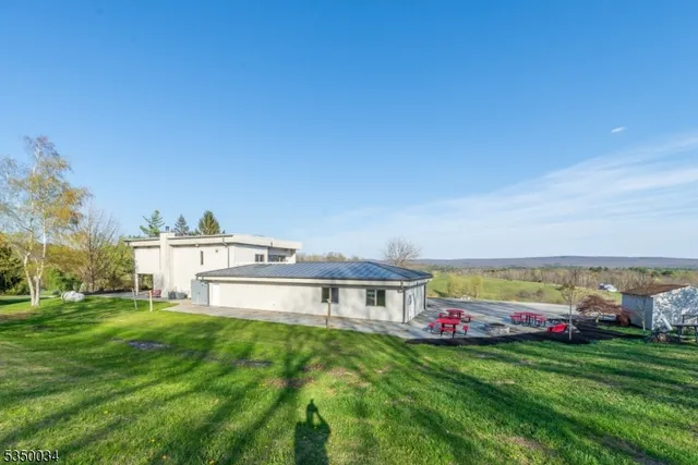 an aerial view of a house with a swimming pool