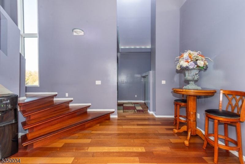 155 Route560 Layton, NJ 07851 - Photo 6 of 42 a room with chandelier fan and wooden floor