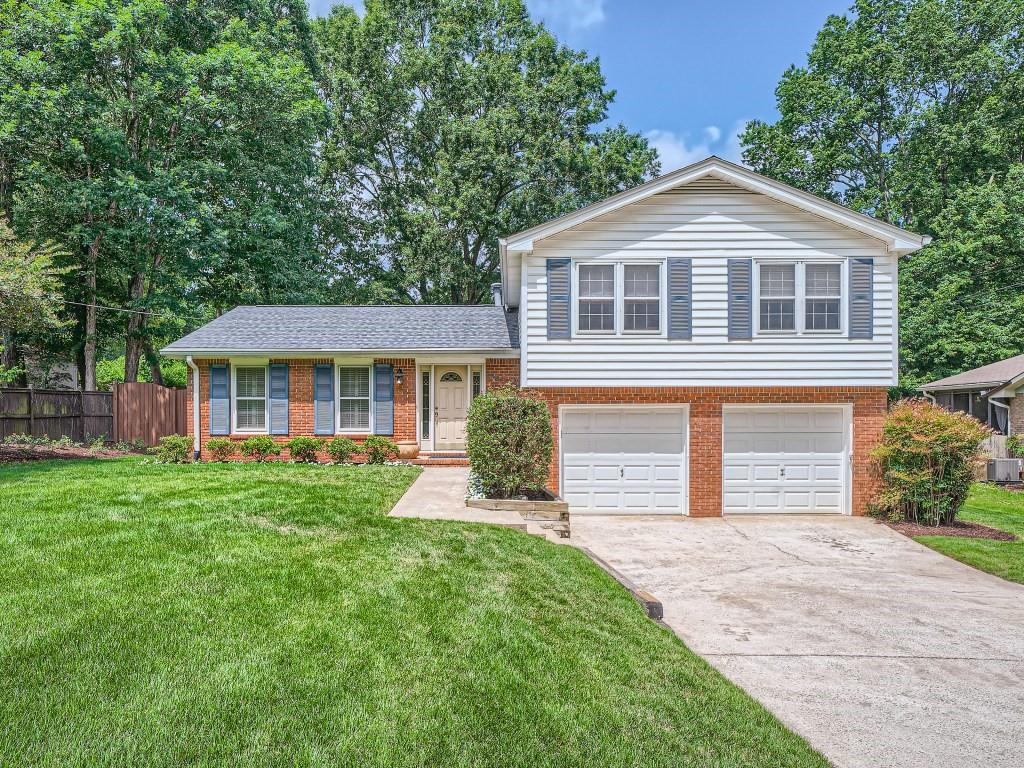 1286 Sanden Ferry Drive Decatur, GA 30033 - Photo 1 of 1 a front view of a house with a yard and porch