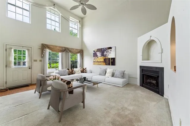 a living room with furniture and a fireplace
