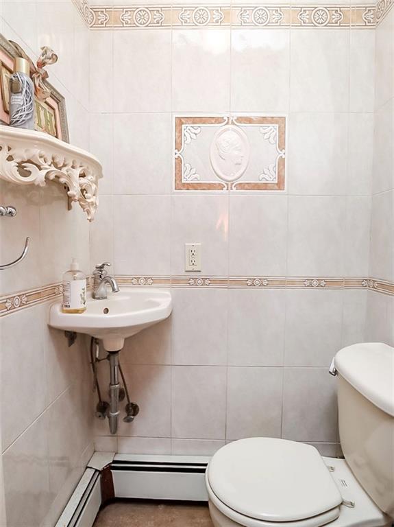 39 Hasbrouk Road Staten Island, NY 10304 - Photo 20 of 50 a bathroom with a sink mirror and toilet