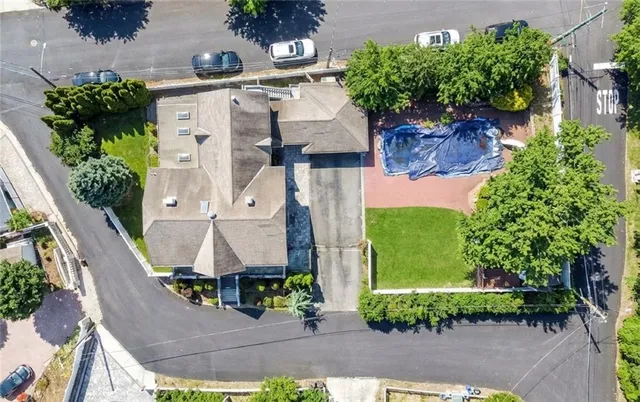 an aerial view of a house with a yard and garden