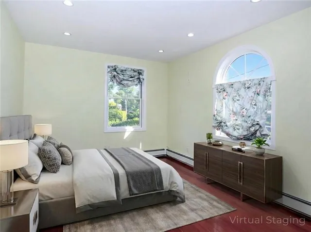 a bedroom with a bed and window