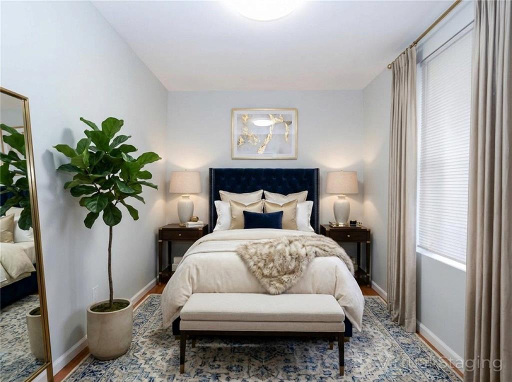 39 Hasbrouk Road Staten Island, NY 10304 - Photo 40 of 50 a bed room with a bed and a potted plant