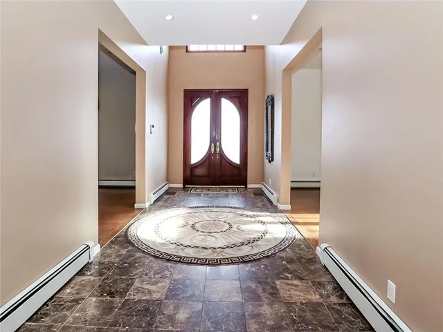 an entryway with table and window